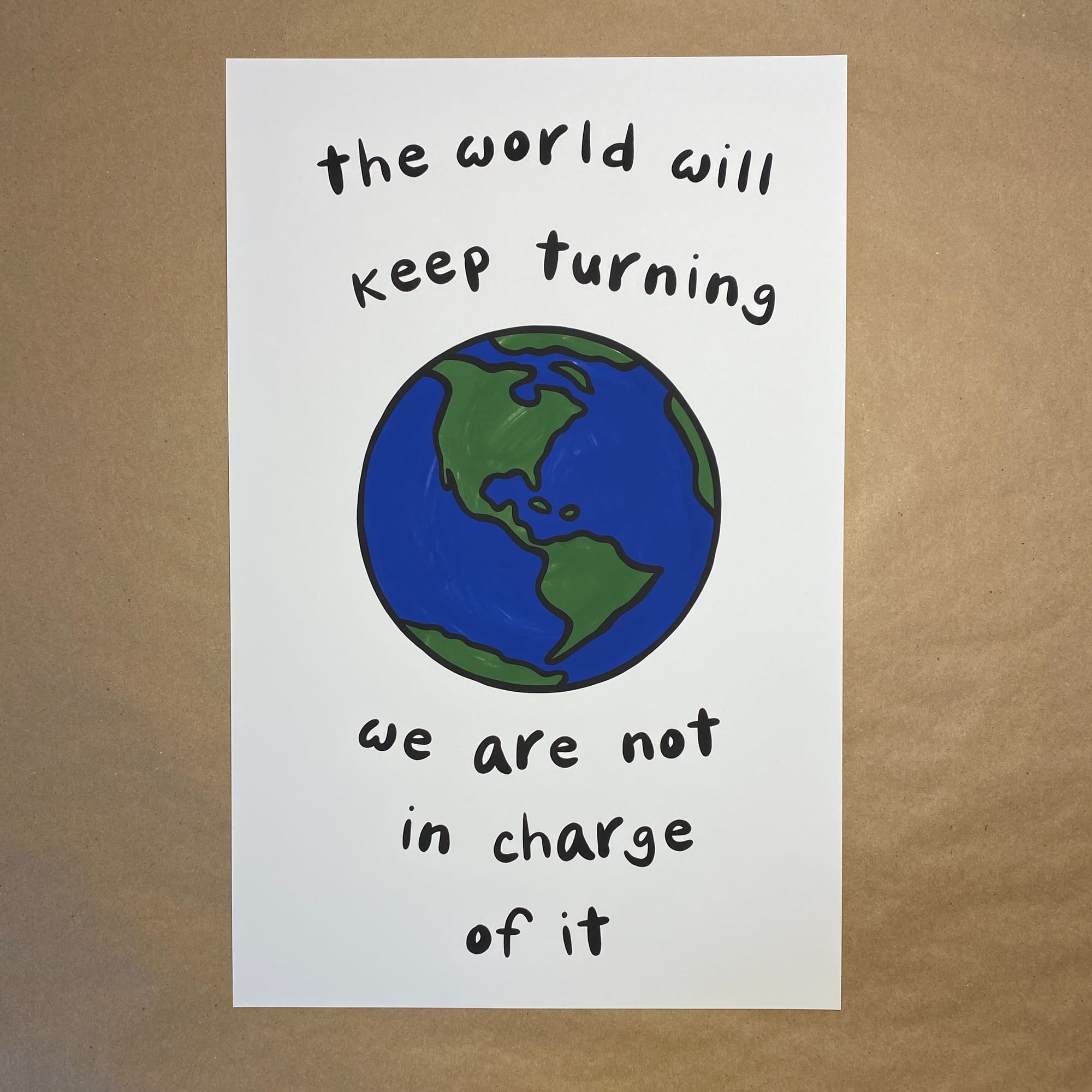 original art by AnneArchy featuring a drawing of the earth as seen from space along with hand lettering of the words "the world will keep turning - we are not in charge of it"