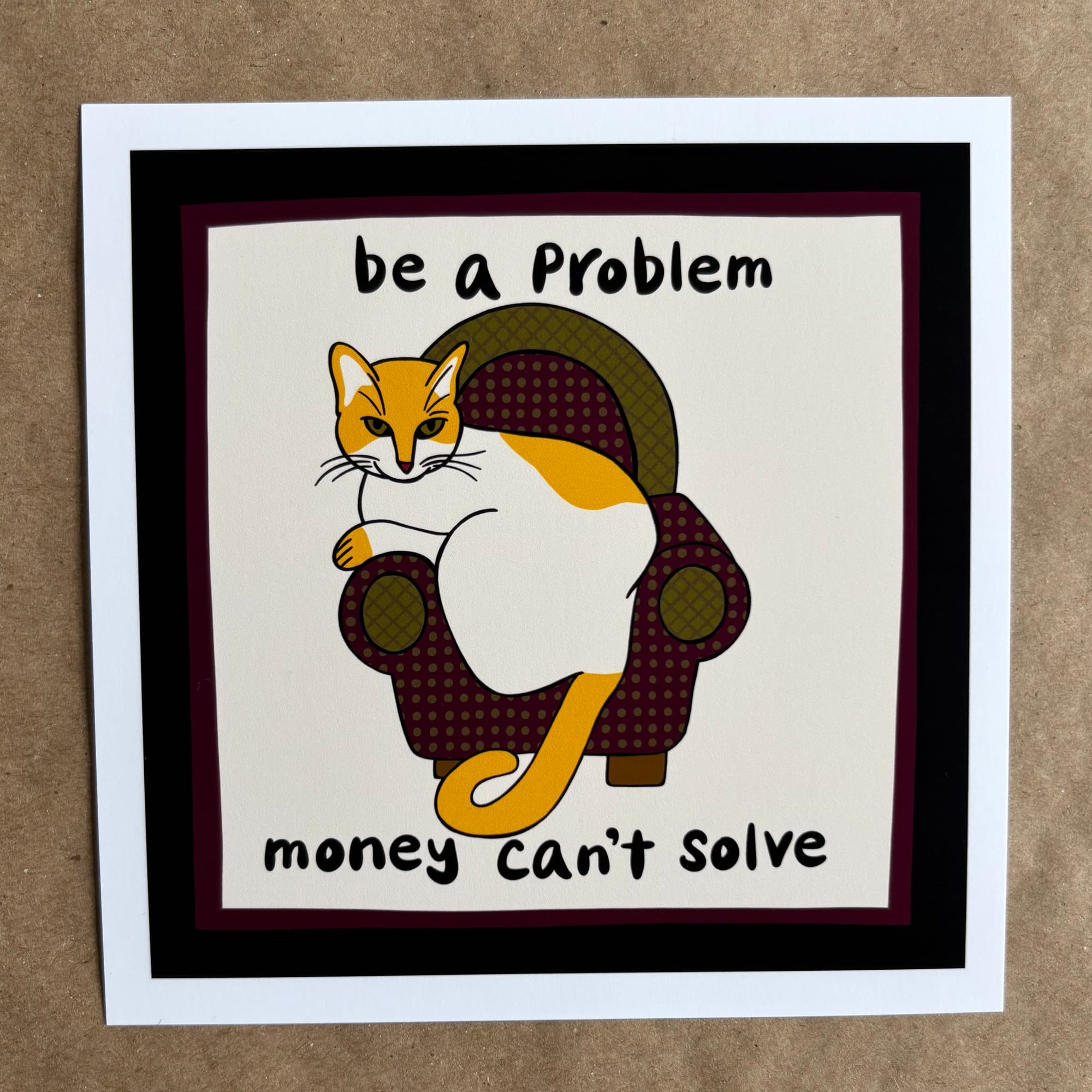 original art by AnneArchy featuring an orange and white cat on a green and purple upholstered armchair with hand lettering of the words "be a problem money can't solve"