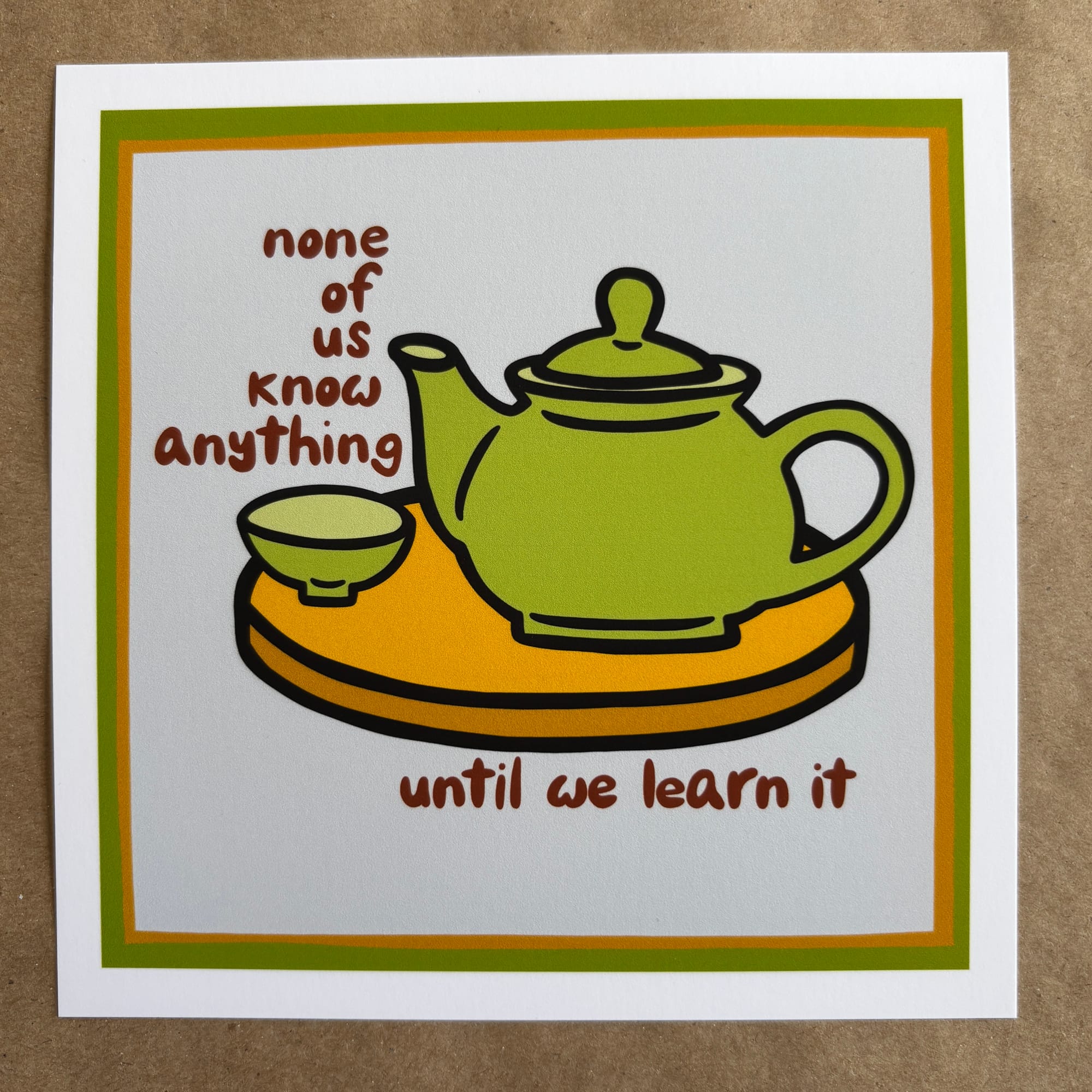 original art by AnneArchy depicting a teapot and tea cup on a tray with hand lettering of the words "none of us know anything until we learn it"