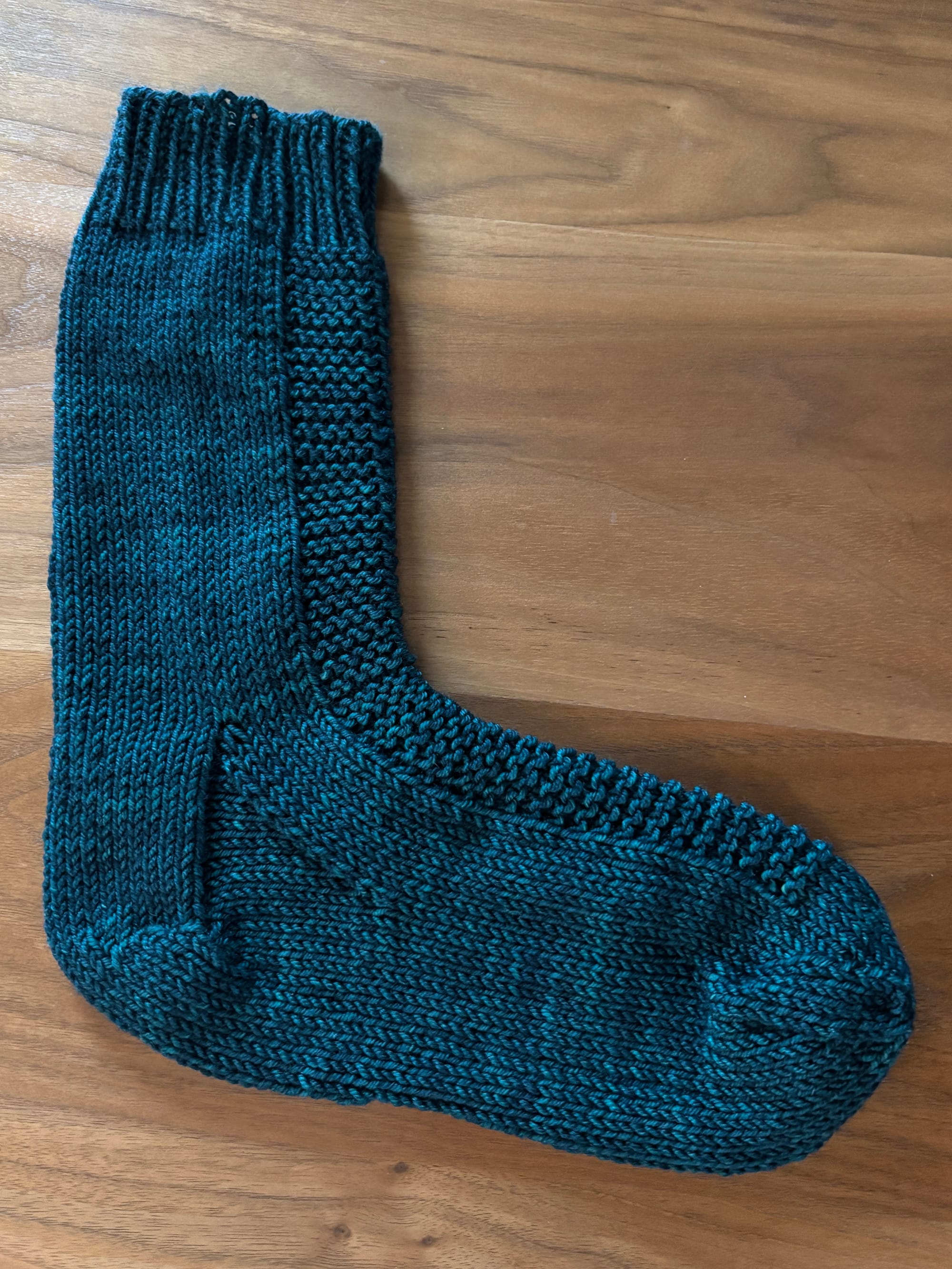 one knit sock worked using the Rye Worsted Sock pattern by Tin Can Knits, worked in Plucky Knitter Primo DK in Infinity and Beyond